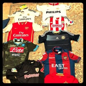 Lot of 9 soccer jerseys.